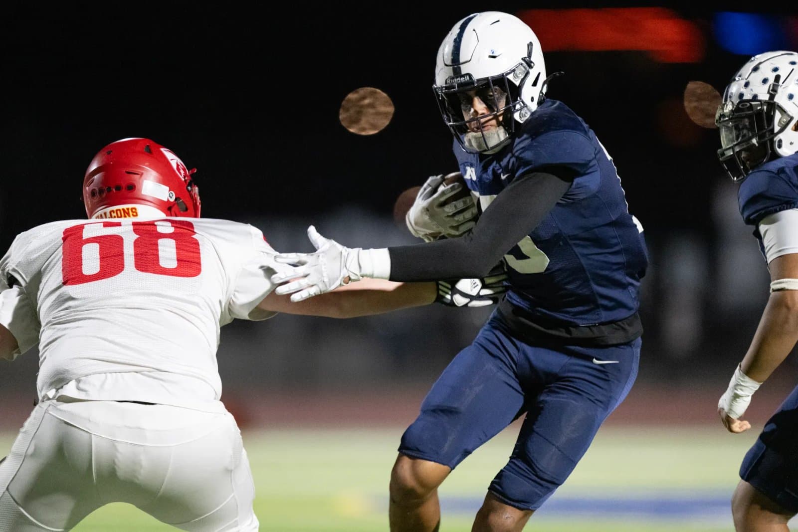 Elian Oliva shedding a block during Northfield vs Skyline